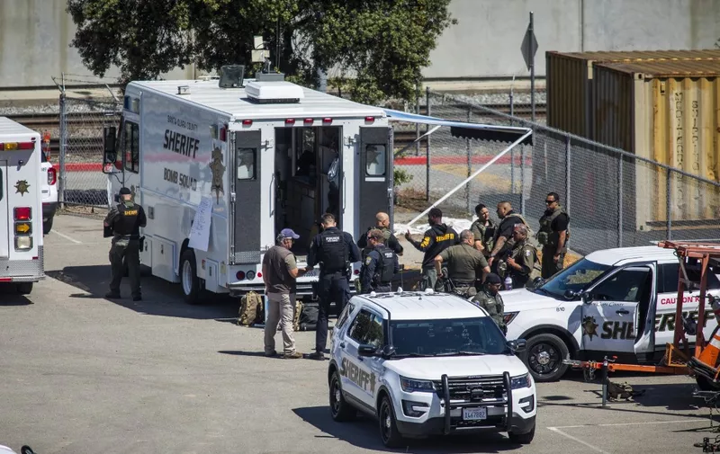 SAN JOSE, CA - MAY 26: Law enforcement gather at the Valley Transportation Authority (VTA) light-rail yard where a mass shooting occurred on May 26, 2021 in San Jose, California. A VTA employee opened fire at the yard, with preliminary reports indicating nine people dead including the gunman.   Philip Pacheco/Getty Images/AFP (Photo by Philip Pacheco / GETTY IMAGES NORTH AMERICA / Getty Images via AFP)