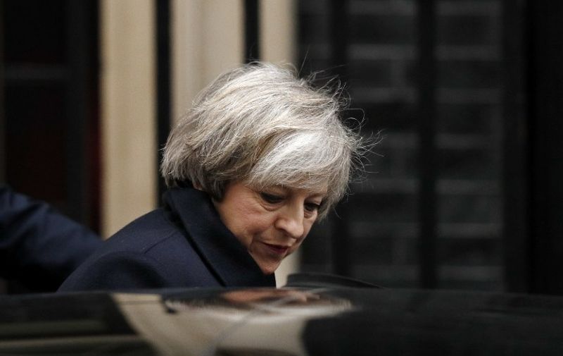 Britain's Prime Minister Theresa May walks out of No.10 Downing Street on her way to the Houses of Parliament in London on February 8, 2017. 
The bill empowering the government to begin the formal process of leaving the European Union is due to reach its final stages later in the day.  / AFP PHOTO / ADRIAN DENNIS