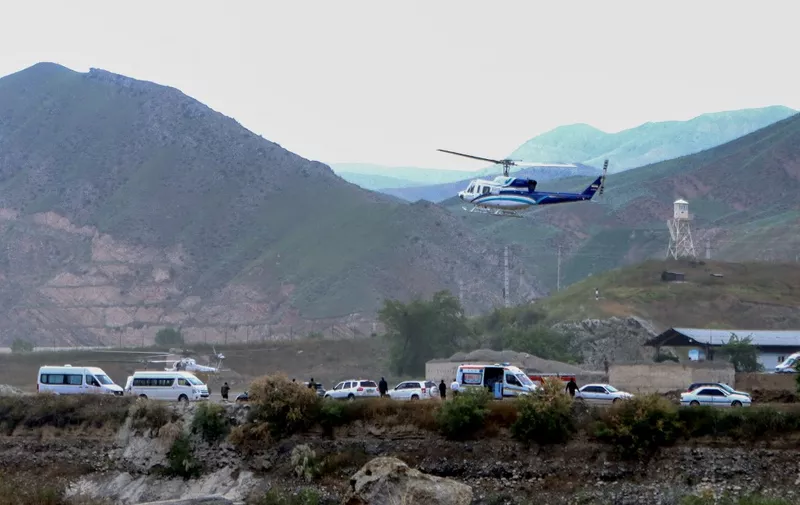 In this photo provided by Islamic Republic News Agency IRNA on May 19, 2024, shows the helicopter carrying Iran's President Ebrahim Raisi taking off at the Iranian border with Azerbaijan after the inauguration of the dam of Qiz Qalasi, in Aras. A helicopter in the convoy of the Iranian president was involved in "an accident" in East Azerbaijan province on May 19, state televsion reported, without specifying if the president was on board. (Photo by Ali Hamed HAGHDOUST / IRNA / AFP)