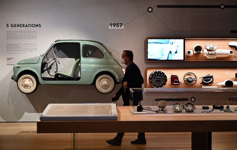 A visitor walks in The Casa 500, the the museum dedicated to Fiat 500ks history, located at the top of the Lingotto, the historical factory of Fiat, in Turin on September 22, 2021. (Photo by MARCO BERTORELLO / AFP)