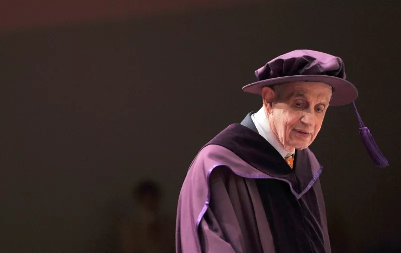 (FILES) Professor John  Nash, winner of the Nobel Prize in Economic Sciences, was conferred an honorary doctorate of science at the City University of Hong Kong in this November 8, 2011, file photo. Nash and his wife, Alicia, were killed on May 23, 2015, when the taxi they were riding struck a guard rail on the New Jersey Turnpike, according to New Jersey State police. Nash's life was the subject of the Oscar-winning film "A Beauitiful Mind." Nash was 86; his wife was 82.  AFP PHOTO / AARON TAM/FILES