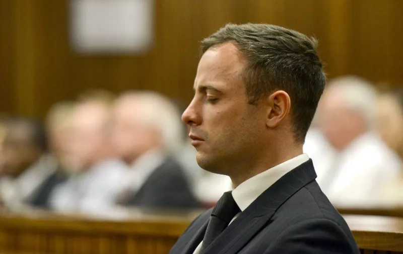 Paralympian Oscar Pistorius is seen during his sentencing for the killing of his girlfriend Reeva Steenkamp at the high court in Pretoria, on October 21, 2014. Pistorius was sentenced to five years imprisonment for the culpable homicide killing of Steenkamp was also sentenced to three years, suspended for five years, for firing a pistol under a table at Tasha's restaurant in Johannesburg in January 2013. The sentences run concurrently. AFP PHOTO/POOL / HERMAN VERWEY