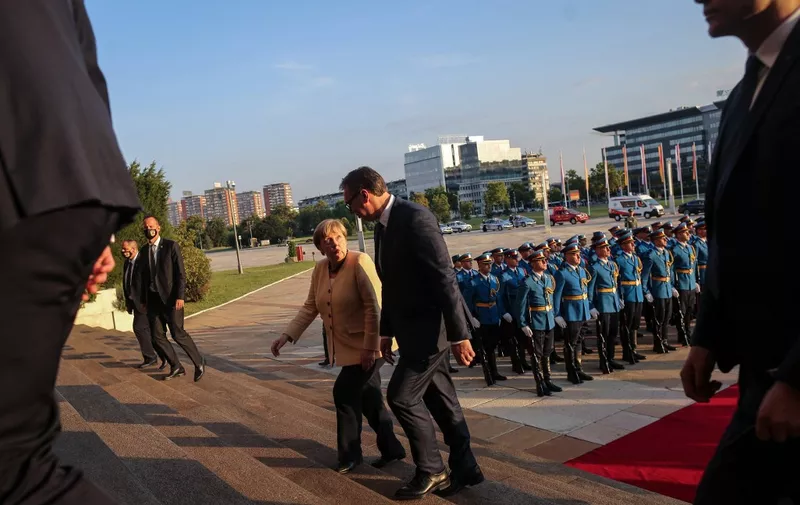German Chancellor Angela Merkel (2nd R) and Serbian President Aleksandar Vucic (R) inspect a military guard of honour prior to their meeting in Belgrade, Serbia, on September, 13, 2021. - Angela Merkel is on a three-day visit to the Balkan States of Serbia and Albania. (Photo by OLIVER BUNIC / AFP)