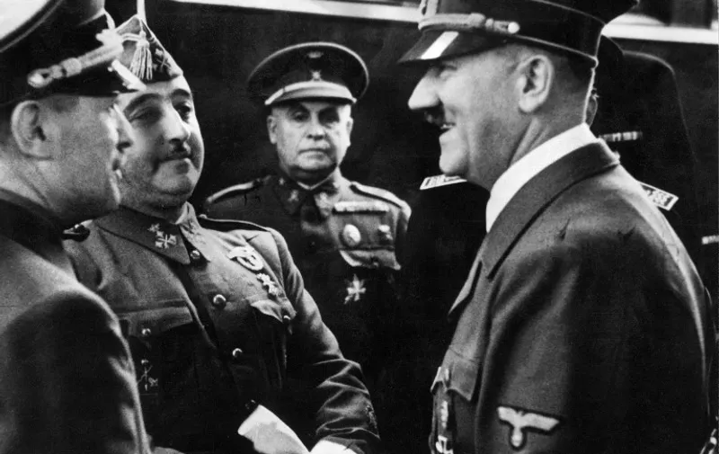 Nazi leader German Chancellor Adolf Hitler (R) shakes hands with Spanish Generalissimo Francisco Franco at Hendaye train station on the French-Spanish border 23 October 1940.