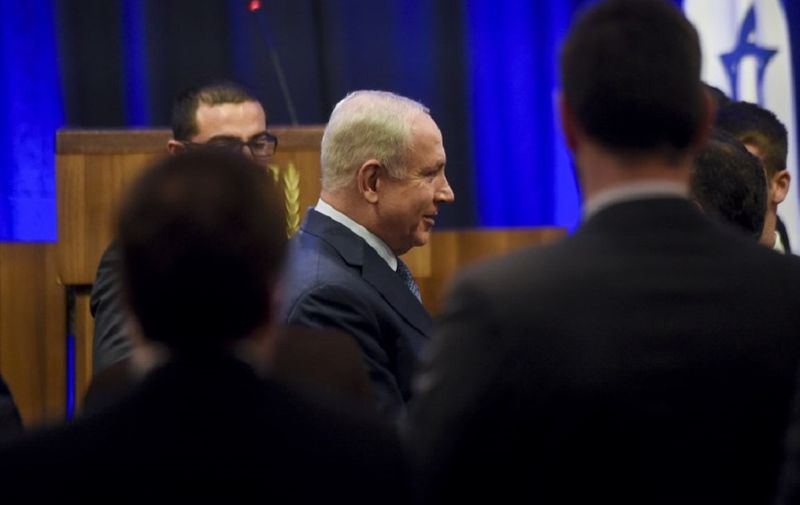 Israeli Prime Minister Benjamin Netanyahu (C) arrives for a meeting with businessmen in Buenos Aires, on September 12, 2017.
Netanyahu, who is accompanied by a 30-member delegation of Israeli business leaders on his two-day official visit to Argentina, said Israel was an "innovation nation" eager to share opportunities with Argentina in agriculture, water, IT, cyber security and health. / AFP PHOTO / Eitan ABRAMOVICH