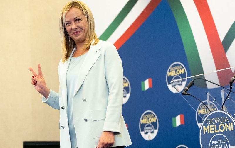 Leader of Fratelli d'Italia (Brothers of Italy) Giorgia Meloni smiles as she makes the victory gesture during a press conference at Parco dei Principi Grand Hotel in Rome, Central Italy, on September 26, 2022. The turnout was the lowest ever at 63,95% and Fratelli d'Italia  is the first party with almost 26%. (Photo by Eliano Imperato / Controluce via AFP)