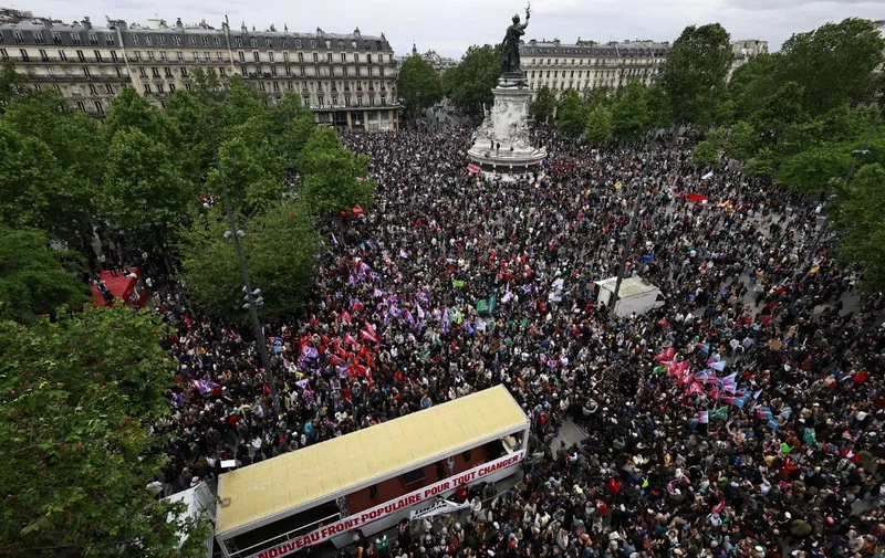 Protesters gather during an anti far-right rally after French president called legislative elections following far-right parties' significant gains in European Parliament elections, in Paris on June 15, 2024. Less than a week after the earthquake of the dissolution, opponents of the far-right are called by trade unions, associations and the left-wing coalition of the "Nouveau Front Populaire" to take to the streets across France. (Photo by Sameer Al-Doumy / AFP)