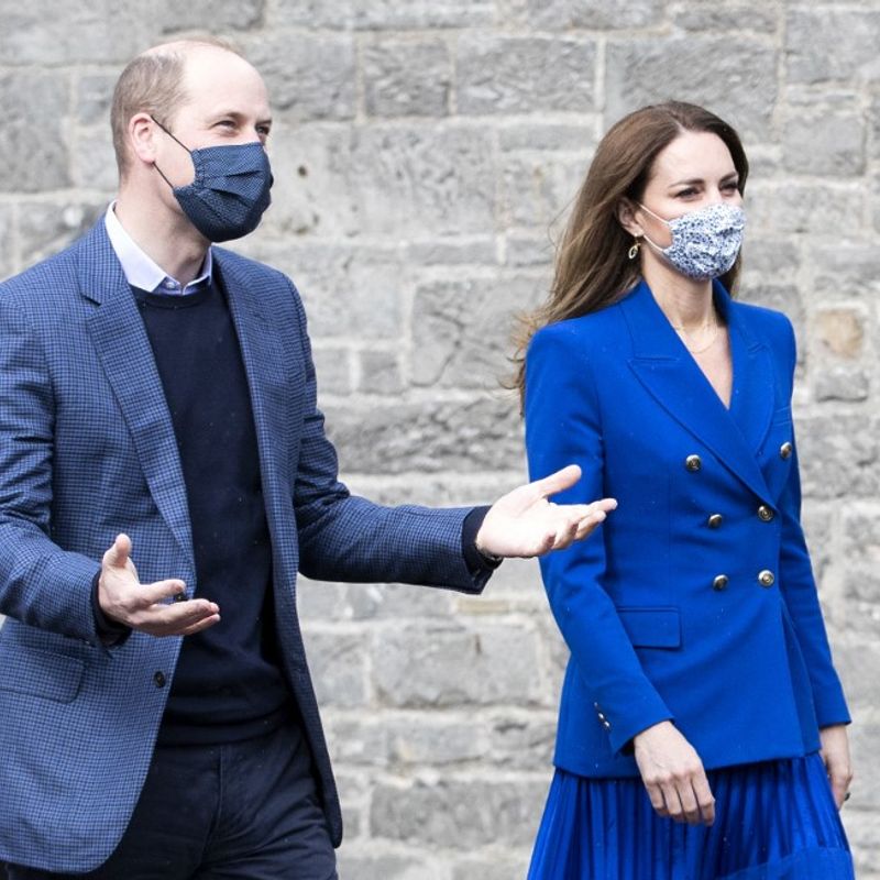 Britain's Prince William, Duke of Cambridge (L) and Britain's Catherine, Duchess of Cambridge, wear protective face coverings to combat the spread of the coronavirus, as they arrive to meet with representatives of Sikh Sanjog, a Sikh community group, in the cafe kitchen at the Palace of Holyroodhouse, in Edinburgh on May 24, 2021, during the Duke's week-long visit to Scotland. - During the visit the Duke and Duchess meet representatives of a Sikh community group to hear about their work. (Photo by Jane Barlow / POOL / AFP)