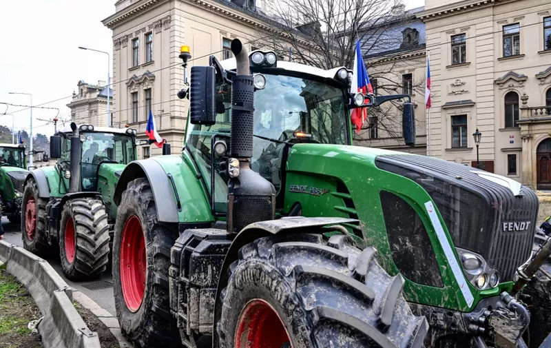 Farmers drive their tractors outside the Czech government building complex during a protest in Prague, Czech Republic, on March 7, 2024 as they demonstrate against the Czech government's policy, and also against the European Union's "Green Deal", a set of laws for helping the bloc meet its climate goals, that turns politically toxic under fire from farmers across Europe. (Photo by Michal Cizek / AFP)