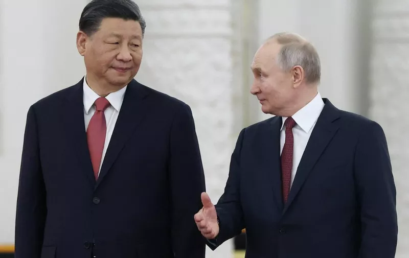 Russian President Vladimir Putin meets with China's President Xi Jinping at the Kremlin in Moscow on March 21, 2023. (Photo by Sergei KARPUKHIN / SPUTNIK / AFP)