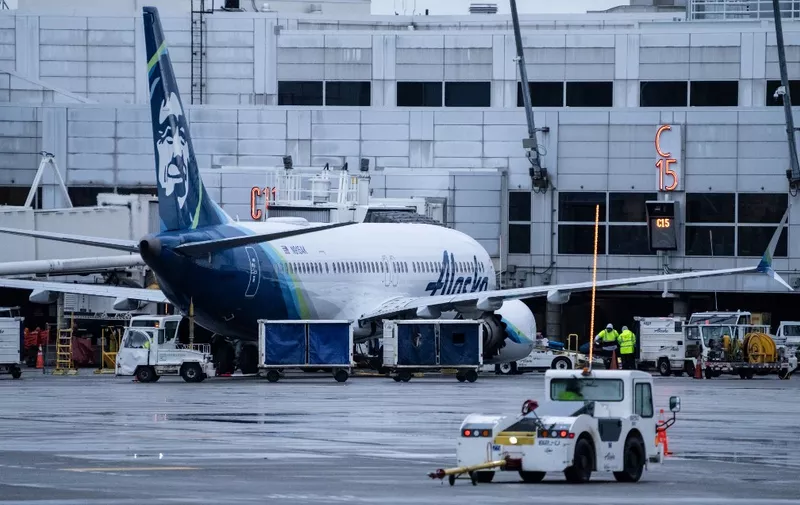 SEATTLE, WASHINGTON - JANUARY 6: An Alaska Airlines Boeing 737 MAX 9 plane sits at a gate at Seattle-Tacoma International Airport on January 6, 2024 in Seattle, Washington. Alaska Airlines grounded its 737 MAX 9 planes after part of a fuselage blew off during a flight from Portland Oregon to Ontario, California.   Stephen Brashear/Getty Images/AFP (Photo by STEPHEN BRASHEAR / GETTY IMAGES NORTH AMERICA / Getty Images via AFP)