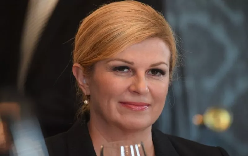 Croatian President Kolinda Grabar-Kitarovic listens to her Hungarian counterpart (not pictured) at the presidental palace in Budapest on September 12, 2017 prior to their working lunch.   
The Croatian guest is on her one-day non-official visit to Budapest as few days ago official Hungary, along with Slovenia, blocked Croatia's membership request for the Organization for Economic Co-operation and Development (OECD). / AFP PHOTO / ATTILA KISBENEDEK