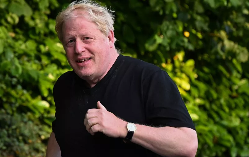 Former British Prime Minister Boris Johnson leaves his house for a run in Brightwell-cum-Stowell, west of London on June 14, 2023. (Photo by JUSTIN TALLIS / AFP)