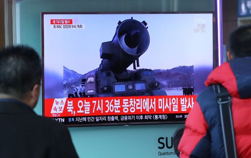 Television news coverage showing archive footage of a North Korean missile launch is broadcast on a public screen  in Seoul on March 6, 2017.
Nuclear-armed North Korea fired four ballistic missiles east of the peninsula, with Japan saying three of them landed in its waters. Pyongyang fired a ballistic missile last month -- its first such launch since October -- which Seoul said was aimed at testing the response from the new US administration of President Donald Trump.
 / AFP PHOTO / YONHAP / STR / REPUBLIC OF KOREA OUT  NO ARCHIVES  RESTRICTED TO SUBSCRIPTION USE
