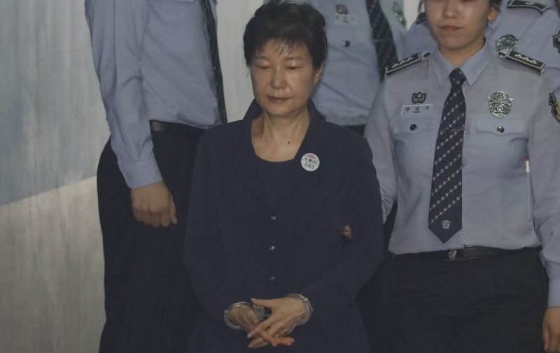 South Korean ousted leader Park Geun-hye arrives at a court in Seoul on May 23, 2017.
Park Geun-Hye was due in court on May 23 to face trial over the massive corruption scandal that led to her stunning downfall. / AFP PHOTO / POOL / KIM HONG-JI