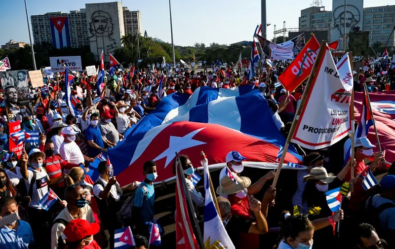 People march during the commemoration of May Day (Labour Day) to mark the international day of the workers, at Havana's Revolution Square, on May 1, 2022. (Photo by Yamil LAGE / AFP)