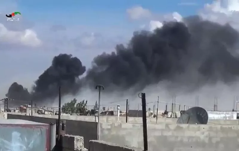 An image grab taken from a video released by the Homs Media Center on September 30, 2015 shows smoke billowing from buildings in the central Syrian town of Talbisseh in Homs province. Russian warplanes carried out air strikes in three Syrian provinces, including Homs, along with regime aircraft on September 30, according to a Syrian security source. Earlier in the day, the Syrian Observatory for Human Rights, a Britain-based monitor, reported at least 27 civilians had been killed in air strikes in the Homs province, adding that the strikes hit Rastan, Talbisseh and Zaafarani. The other Syrian security source said the Russian strikes had hit Rastan and Talbisseh in the province of Homs.  AFP PHOTO / Homs Media Center
=== RESTRICTED TO EDITORIAL USE - MANDATORY CREDIT "AFP PHOTO / Homs Media Center" - NO MARKETING NO ADVERTISING CAMPAIGNS - DISTRIBUTED AS A SERVICE TO CLIENTS === / AFP / Homs Media Center / -