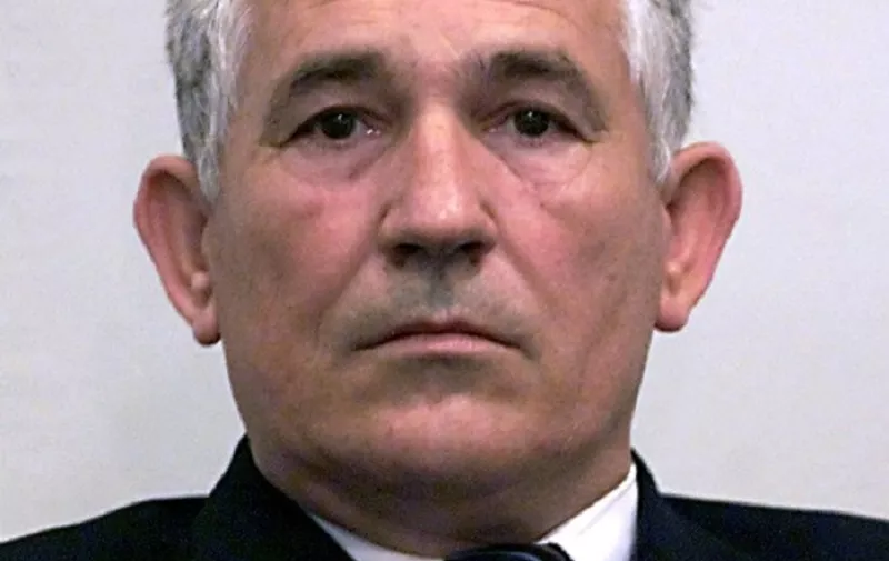 Retired Yugoslav Army Gen. Mile Mrksic sits in the U.N. war crimes tribunal courtroom in The Hague 16 May 2002. Mrksic, who surrendered to the tribunal Wednesday, is indicted for the summary execution of at least 200 Croatians in 1991 in the Croat town of Vukovar. (AP Photo/Serge Ligtenberg) POOL