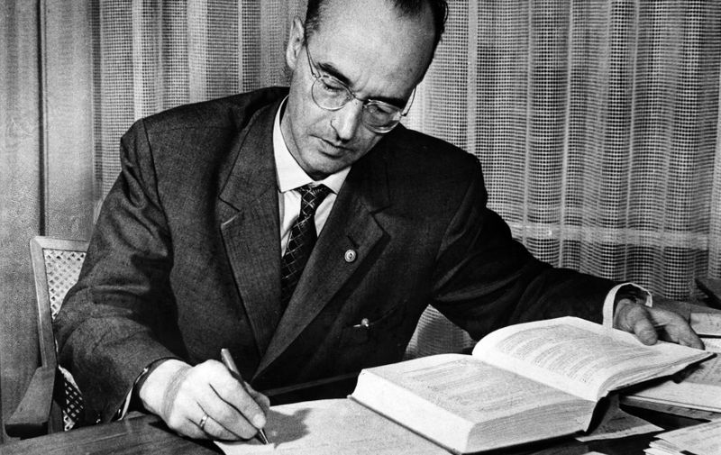 KLAUS FUCHS (1911-1988). German-born physicist who worked on developing the atomic bomb in England and the United States, and was convicted for passing information to the Soviet Union as a spy. Photographed in his office as Deputy Director at the Institute for Nuclear Research in Rossendorf, Dresden, Germany, 1959.,Image: 341503642, License: Rights-managed, Restrictions: It is in the duty of the user of the image to clear prior to usage if any Third Party rights preclude the intended use. It is in the duty of the user of the image to clear prior to usage if any Third Party rights preclude the intended use. | Es obliegt dem Nutzer zu prüfen, ob Rechte Dritter an den Bildinhalten der beabsichtigten Nutzung des Bildmaterials entgegen stehen., Model Release: no