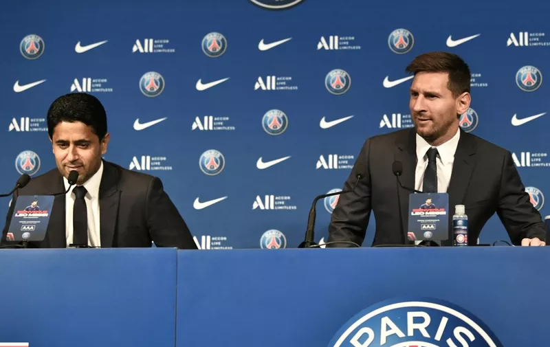 Paris Saint-Germain's Qatari president Nasser Al-Khelaifi (L) and Argentinian football player Lionel Messi attend the player's unveiling press conference at the French football club Paris Saint-Germain's (PSG) Parc des Princes stadium in Paris on August 11, 2021. - The 34-year-old superstar signed a two-year deal with PSG on August 10, 2021, with the option of an additional year, he will wear the number 30 in Paris, the number he had when he began his professional career at Spain's Barca football club. (Photo by STEPHANE DE SAKUTIN / AFP)