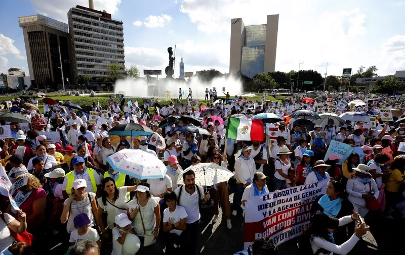 Members of civil and religious organizations march during a national protest called "In Favor of Women and Life" against the decriminalization of abortion in Guadalajara, Mexico, on October 8, 2022. (Photo by Ulises Ruiz / AFP)