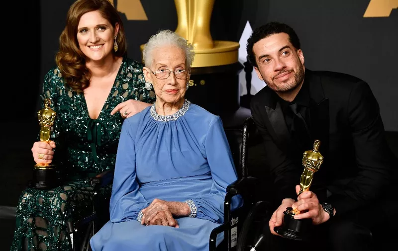 (FILES) In this file photo NASA mathematician Katherine Johnson (C) and director Ezra Edelman (R) and producer Caroline Waterlow (L), winners of Best Documentary Feature for "O.J.: Made in America" pose in the press room during the 89th Annual Academy Awards at Hollywood &amp; Highland Center on February 26, 2017 in Hollywood, California. - Katherine Johnson, whose calculations enabled Apollo 11 to land on the moon, died on February 24, 2020 at 101. Her story was told in the film "Hidden Figures." (Photo by Frazer Harrison / GETTY IMAGES NORTH AMERICA / AFP)