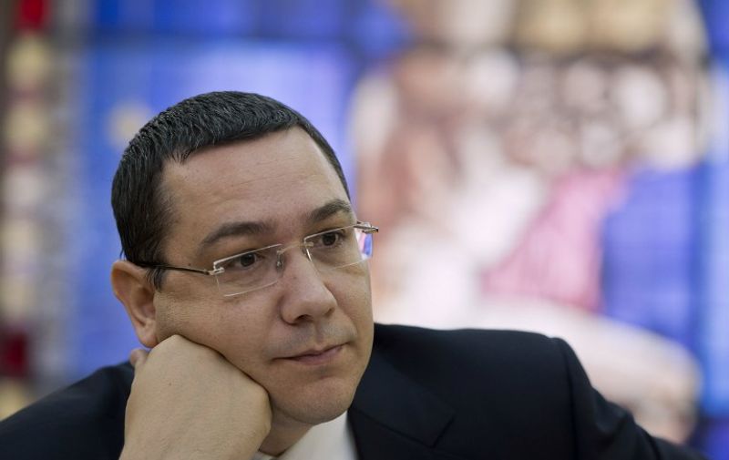 Romanian Prime Minister Victor Ponta is pictured during an interview with journalists at the Romanian Government headquarters in Bucharest on June 9, 2015. Ponta addressed representatives of foreign media few days after he refused to step down despite being hit by corruption allegations, the highest sitting leader targeted in a long-running anti-graft campaign in one of the EU's poorest nations. Parliament still has to make the final decision on whether to strip Ponta of his immunity at a vote today. AFP PHOTO DANIEL MIHAILESCU