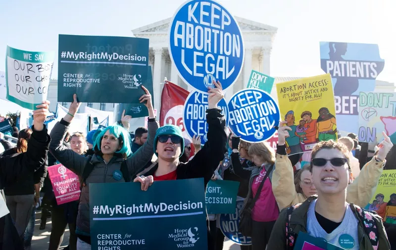 Pro-choice activists supporting legal access to abortion protest during a demonstration outside the US Supreme Court in Washington, DC, March 4, 2020, as the Court hears oral arguments regarding a Louisiana law about abortion access in the first major abortion case in years. - The United States Supreme Court on Wednesday will hear what may be its most significant case in decades on the controversial subject of abortion. At issue is a state law in Louisiana which requires doctors who perform abortions to have admitting privileges at a nearby hospital. (Photo by SAUL LOEB / AFP)