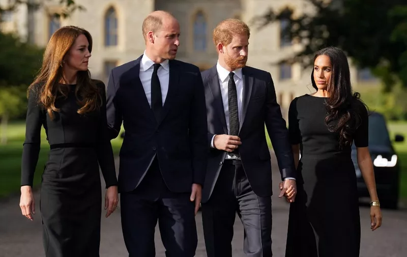 (L-R) Britain's Catherine, Princess of Wales, Britain's Prince William, Prince of Wales, Britain's Prince Harry, Duke of Sussex, and Meghan, Duchess of Sussex on the long Walk at Windsor Castle on September 10, 2022, before meeting well-wishers. King Charles III pledged to follow his mother's example of "lifelong service" in his inaugural address to Britain and the Commonwealth on Friday, after ascending to the throne following the death of Queen Elizabeth II on September 8. (Photo by Kirsty O'Connor / POOL / AFP)