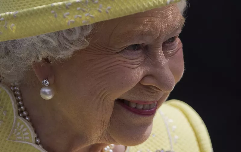(FILES) In this file photo taken on June 10, 2016 Britain's Queen Elizabeth II smiles as she leaves, after attending a national service of thanksgiving for her 90th birthday at St Paul's Cathedral in London, which is also the Duke of Edinburgh's 95th birthday. - Gun salutes will ring out Thursday to mark Queen Elizabeth II's 96th birthday, although the monarch herself was expected to mark the occasion with little fanfare. (Photo by JUSTIN TALLIS / AFP)
