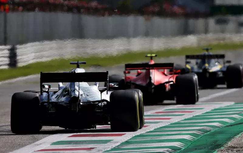 MONZA, ITALY - SEPTEMBER 08: Charles Leclerc of Monaco driving the (16) Scuderia Ferrari SF90 leads Lewis Hamilton of Great Britain driving the (44) Mercedes AMG Petronas F1 Team Mercedes W10 on track during the F1 Grand Prix of Italy at Autodromo di Monza on September 08, 2019 in Monza, Italy. (Photo by Charles Coates/Getty Images)