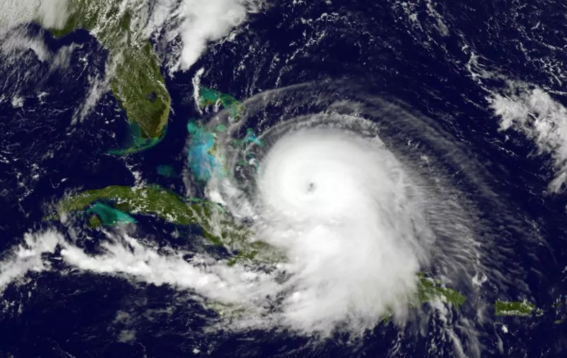 This NASA/NOAA Goes East satellite image taken at 1745 UTC shows Hurricane Joaquin on October 1, 2015. Joaquin strengthened into an extremely dangerous category four hurricane Thursday as it barreled through the Bahamas, US forecasters said. It is now packing maximum sustained winds of 130 miles (210 kilometers) per hour and could get grow even stronger over the next 24 hours, the National Hurricane Center said. The eye will move near or over portions of the central Bahamas Thursday and into the night, and pass near or over portions of the northwestern Bahamas Friday, the NHC said. The storm has potential for life-threatening damage and a course that could dump drenching rain along the US East Coast, forecasters said. AFP PHOTO/ NASA/NOAA  = RESTRICTED TO EDITORIAL USE - MANDATORY CREDIT "AFP PHOTO / NASA/NOAA" - NO MARKETING NO ADVERTISING CAMPAIGNS - DISTRIBUTED AS A SERVICE TO CLIENTS =