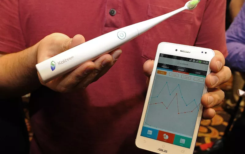 Th Kolibree toothbrush, the world's first Internet-connected toothbrush, is displayed "CES: Unveiled," the media preview for International CES, at the Mandalay Bay Convention Center January 5, 2014 in Las Vegas, Nevada. The Kolibree toothbrush includes a sensor which detects how much tartar is being removed in a brushing. It also records brushing activity so users can maintain a consistent cleaning each time.  The device conveys the information wirelessly to a smartphone app.  The world's largest consumer technology trade show, also known as the Consumer Electronics Show (CES), runs from Jan 7-10 in Las Vegas, Nevada.   AFP PHOTO / ROBYN BECK (Photo by Robyn BECK / AFP)