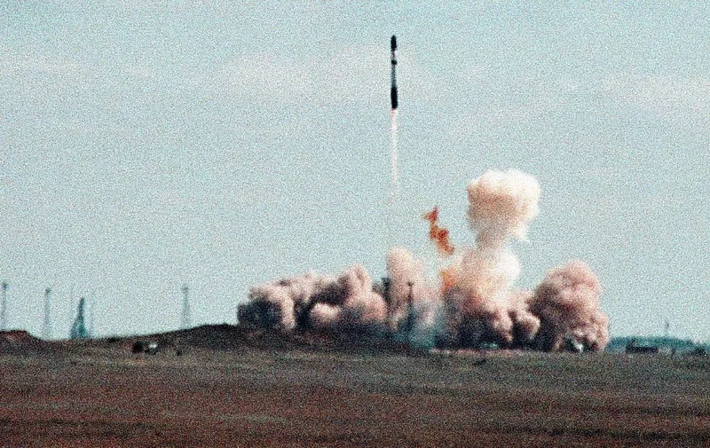 A missile SS-18 ("Satan") with a British satellite instead of a nuclear bomb in its head takes off from the Baikonour cosmodrom in western Kazakhstan, 21 April 1999. It was a test launch, starting a new joint Russo-Ukrainian project called "Dnepr" for the conversion use of strategic nuclear missiles for peaceful commercial launches. (Photo by AFP)