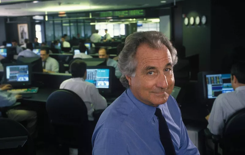 1997, New York, New York, USA: Wall Street legend Bernard Madoff was sentenced to 150 years in federal prison on June, 29th 2009. Madoff was found guilty of defrauding investors of some 50 billion dollars in what is the largest "ponzi" scheme in world history.///Bernard Madoff seated amid employees at their computers, at his office..,Image: 35845926, License: Rights-managed, Restrictions: Exclusive, special rates apply, Model Release: no, Credit line: Profimedia