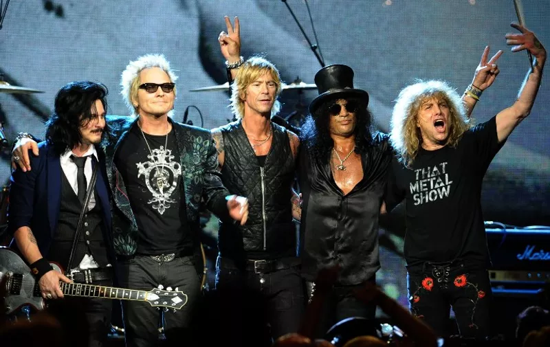 CLEVELAND, OH - APRIL 14: Inductees (L-R) Gilbert Clarke, Matt Sorum, Duff McKagan, Slash and Steven Adler of Guns N' Roses, perform onstage during the 27th Annual Rock And Roll Hall of Fame Induction Ceremony at Public Hall on April 14, 2012 in Cleveland, Ohio.   Michael Loccisano/Getty Images/AFP