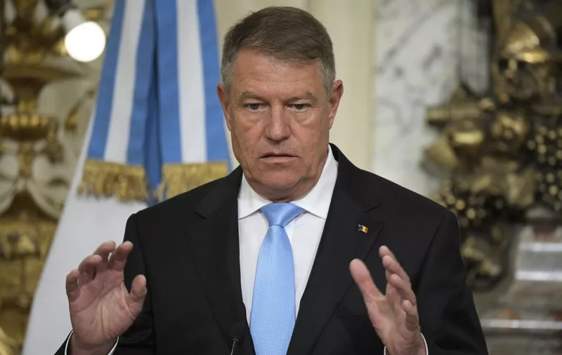 Romanian President Klaus Iohannis speaks during a joint press conference with Argentine President Alberto Fernandez (not in frame) after a bilateral meeting at the Casa Rosada in Buenos Aires on April 25, 2023. (Photo by JUAN MABROMATA / AFP)