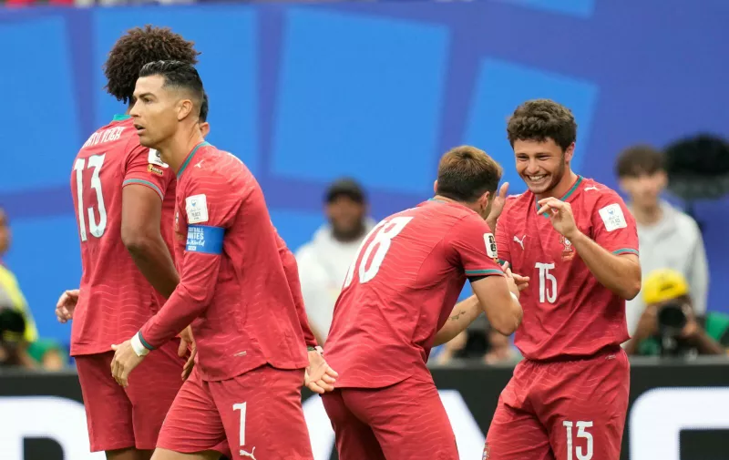 Portugal's Joao Neves, right, celebrates after scoring the opening goal of his team during the World Cup Group K soccer match between Portugal and Congo in Houston, Wednesday, June 17, 2026. (AP Photo/Karen Warren)