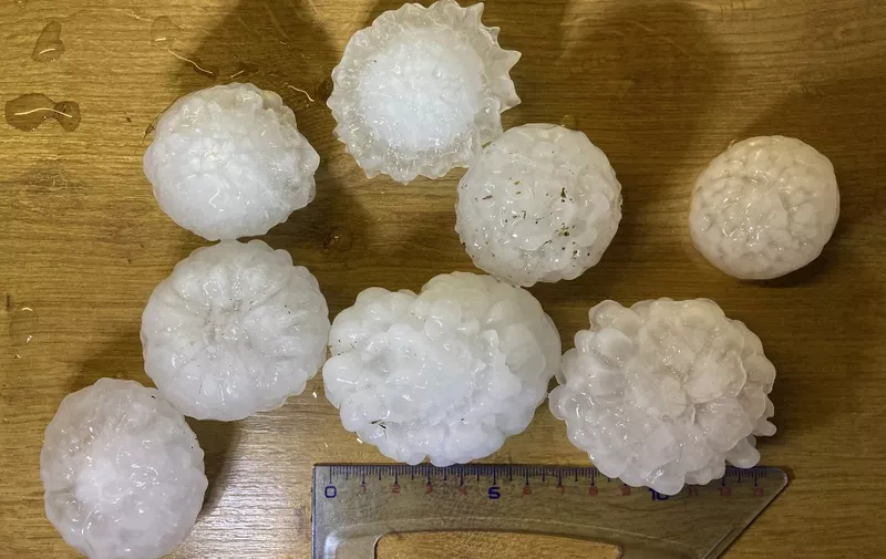 A picture taken on June 4, 2022 shows hail stones felt during a storm in Vensat, central France. - Storms broke across large parts with France France-Meteo warning more storms were on the way, starting in the southwest and moving north and east across the country. (Photo by Thierry ZOCCOLAN / AFP)