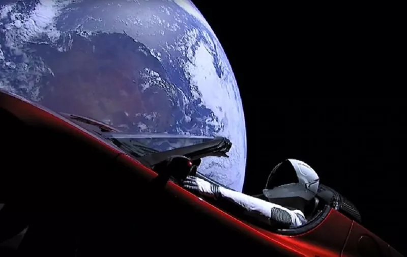 This still image taken from a SpaceX livestream video shows "Starman" sitting in SpaceX CEO Elon Musk's cherry red Tesla roadster after the Falcon Heavy rocket delivered it into orbit around the Earth on February 6, 2018.
Screams and cheers erupted at Cape Canaveral, Florida as the massive rocket fired its 27 engines and rumbled into the blue sky over the same NASA launchpad that served as a base for the US missions to Moon four decades ago. / AFP PHOTO / SPACEX / HO / RESTRICTED TO EDITORIAL USE - MANDATORY CREDIT "AFP PHOTO / SPACEX" - NO MARKETING NO ADVERTISING CAMPAIGNS - DISTRIBUTED AS A SERVICE TO CLIENTS