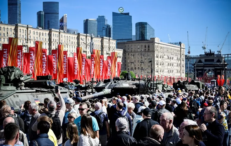 People visit an exhibition showing western military equipment captured by Russian forces in Ukraine, displayed at the WWII memorial complex at Poklonnya Hill western in Moscow, on May 1, 2024. The Russian Ministry of Defence opened an exhibition of samples of "Western weapons and military equipment" captured by Russian forces in Ukraine. The exhibition will last for one month. (Photo by Alexander NEMENOV / AFP)