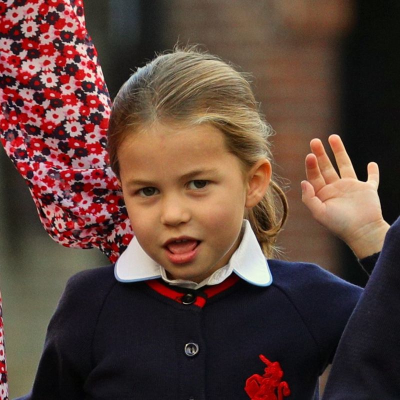 Britain's Princess Charlotte of Cambridge gestures as she arrives for her first day of school at Thomas's Battersea in London on September 5, 2019. (Photo by Aaron Chown / POOL / AFP)
