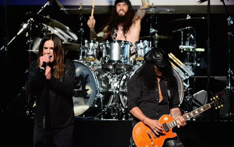 LOS ANGELES, CA - MAY 12: (L-R) Musicians Ozzy Osbourne, Tommy Clufetos and Slash perform onstage at the 10th annual MusiCares MAP Fund Benefit Concert at Club Nokia on May 12, 2014 in Los Angeles, California.   Frazer Harrison/Getty Images/AFP