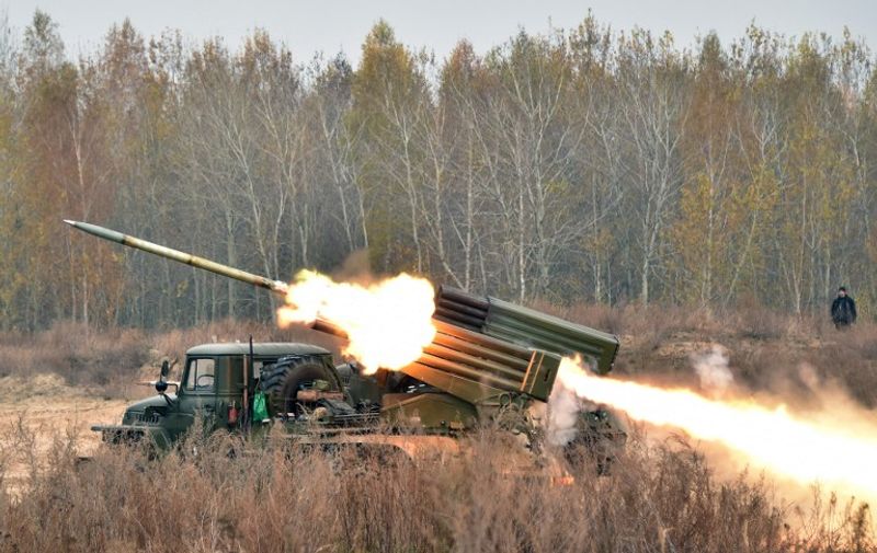 Ukrainian 122 mm MLRS BM-21 Grad fires rocket during a military exercise at a shooting range  close to Devichiki in the Kiev region on October 28, 2016. / AFP PHOTO / GENYA SAVILOV