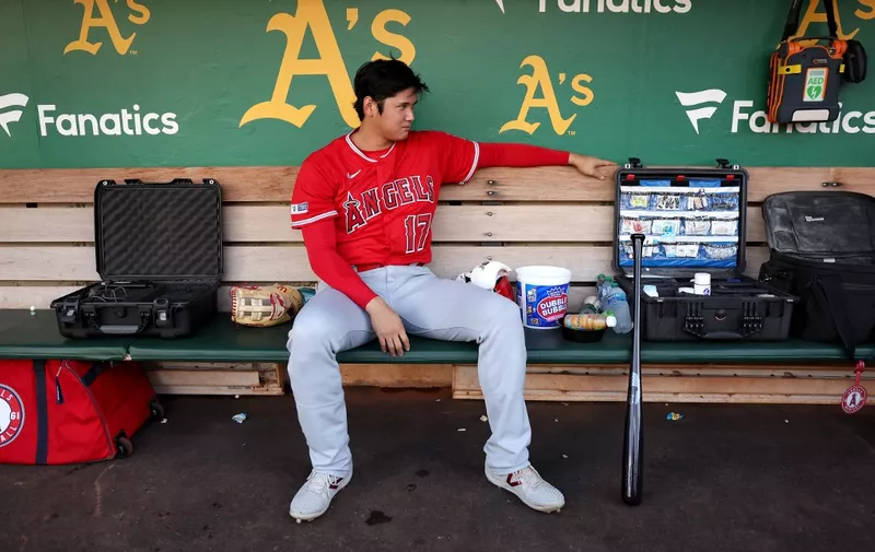 OAKLAND, CALIFORNIA - SEPTEMBER 01: Shohei Ohtani #17 of the Los Angeles Angels sits in the dugout before their game against the Oakland Athletics at RingCentral Coliseum on September 01, 2023 in Oakland, California.   Ezra Shaw/Getty Images/AFP (Photo by EZRA SHAW / GETTY IMAGES NORTH AMERICA / Getty Images via AFP)