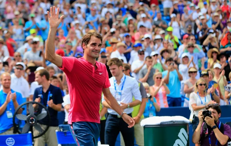 CINCINNATI, OH - AUGUST 23: Roger Federer of Switzerland celebrates after defeating Novak Djokovic of Serbia to win the mens singles final at the Western &amp; Southern Open at the Linder Family Tennis Center on August 23, 2015 in Cincinnati, Ohio.   Rob Carr/Getty Images/AFP