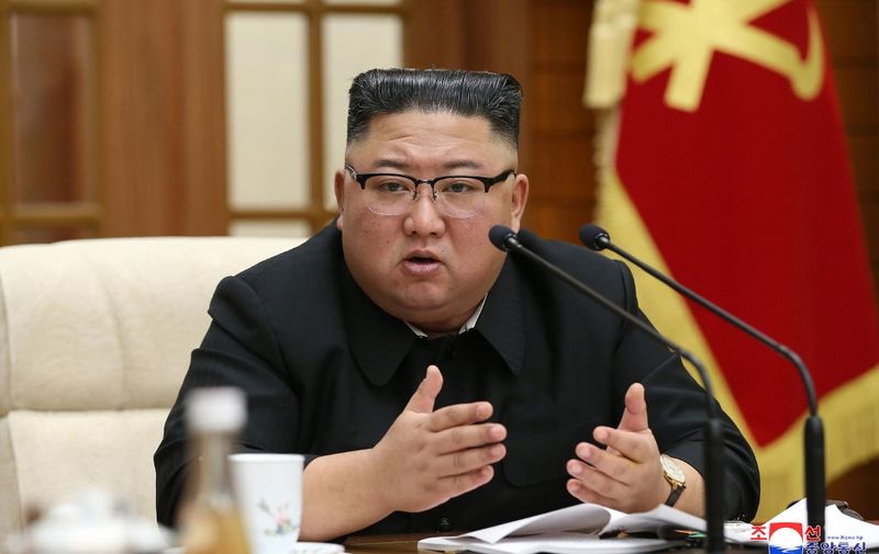 This picture taken on November 29, 2020 and released from North Korea's official Korean Central News Agency (KCNA) on November 30, 2020 shows North Korean leader Kim Jong Un attending a meeting of the 21st Political Bureau of the 7th Central Committee of the Workers' Party of Korea (WPK) at the office building of the Party Central Committee in Pyongyang. (Photo by STR / KCNA VIA KNS / AFP) / South Korea OUT / ---EDITORS NOTE--- RESTRICTED TO EDITORIAL USE - MANDATORY CREDIT "AFP PHOTO/KCNA VIA KNS" - NO MARKETING NO ADVERTISING CAMPAIGNS - DISTRIBUTED AS A SERVICE TO CLIENTS / THIS PICTURE WAS MADE AVAILABLE BY A THIRD PARTY. AFP CAN NOT INDEPENDENTLY VERIFY THE AUTHENTICITY, LOCATION, DATE AND CONTENT OF THIS IMAGE --- /
