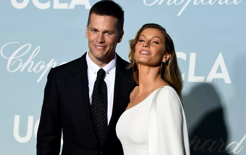(FILES) In this file photo taken on February 21, 2019, (L-R) Tom Brady and Gisele Bündchen attend the 2019 Hollywood For Science Gala in Los Angeles, California. - Brady and Bundchen will file for divorce on October 28, 2022, ending their 13-year marriage, multiple US media reports said. People magazine and TMZ.com said Brady and Bundchen had reached a settlement agreement and that divorce papers would be filed in Florida later on October 28. (Photo by KEVIN WINTER / GETTY IMAGES NORTH AMERICA / AFP)