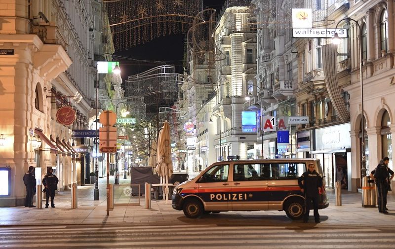 Armed policemen stand guard in a shopping street in the center of Vienna on November 2, 2020, following a shooting. - Multiple gunshots were fired in central Vienna on the evening of November 2, 2020, according to police, with the location of the incident close to a major synagogue. Police urged residents to keep away from all public places or public transport. One attacker was "dead" and another "on the run", with one police officer being seriously injured, Austria's interior ministry said according to news agency APA. (Photo by JOE KLAMAR / AFP)