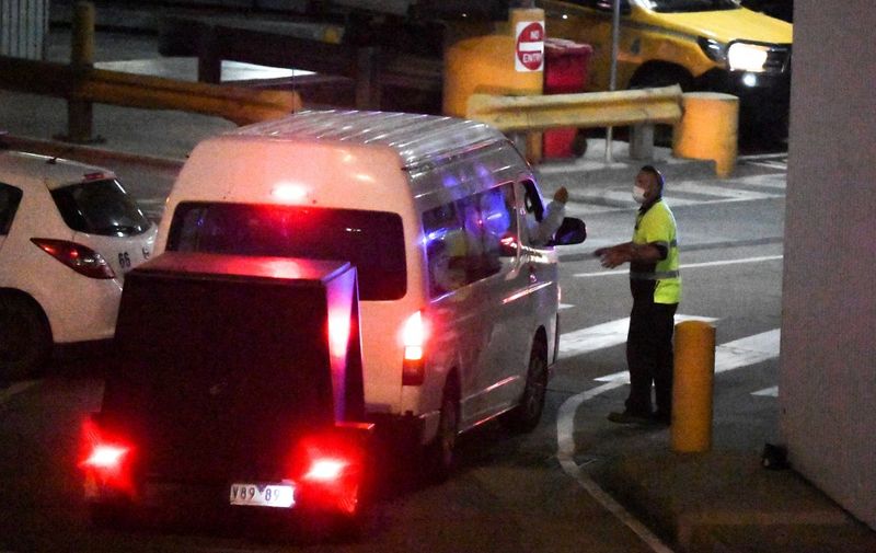 A police convoy arrives at Melbourne airport as Malka Leifer, a former principal at a Jewish ultra-Orthodox school is returned to Australia under extradition on January 27, 2021 to face dozens of charges of child sexual assault, more than 12 years after she fled the country. (Photo by William WEST / AFP)